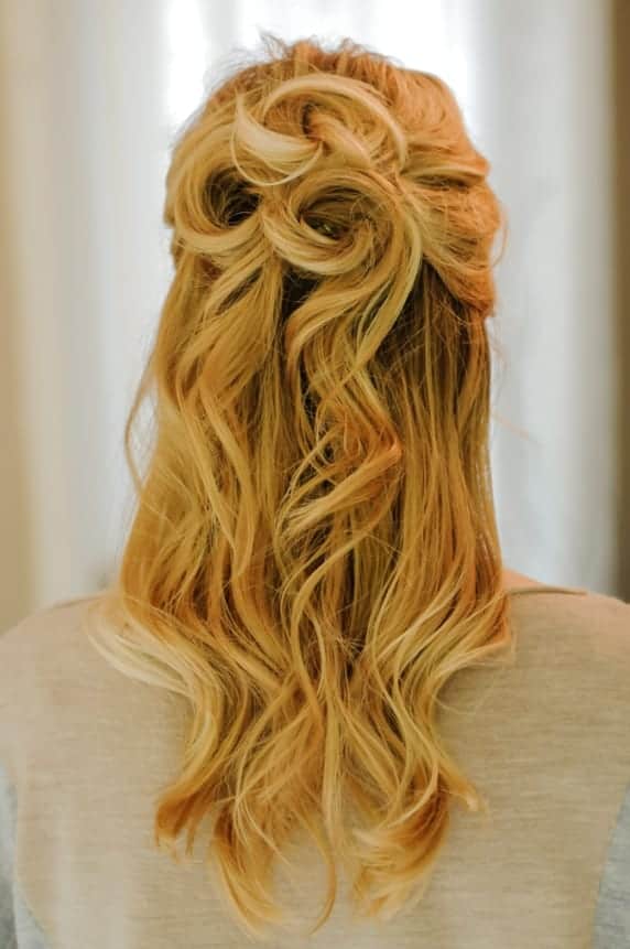 ... half up half down hairdo makes for the perfect prom hairstyle! via
