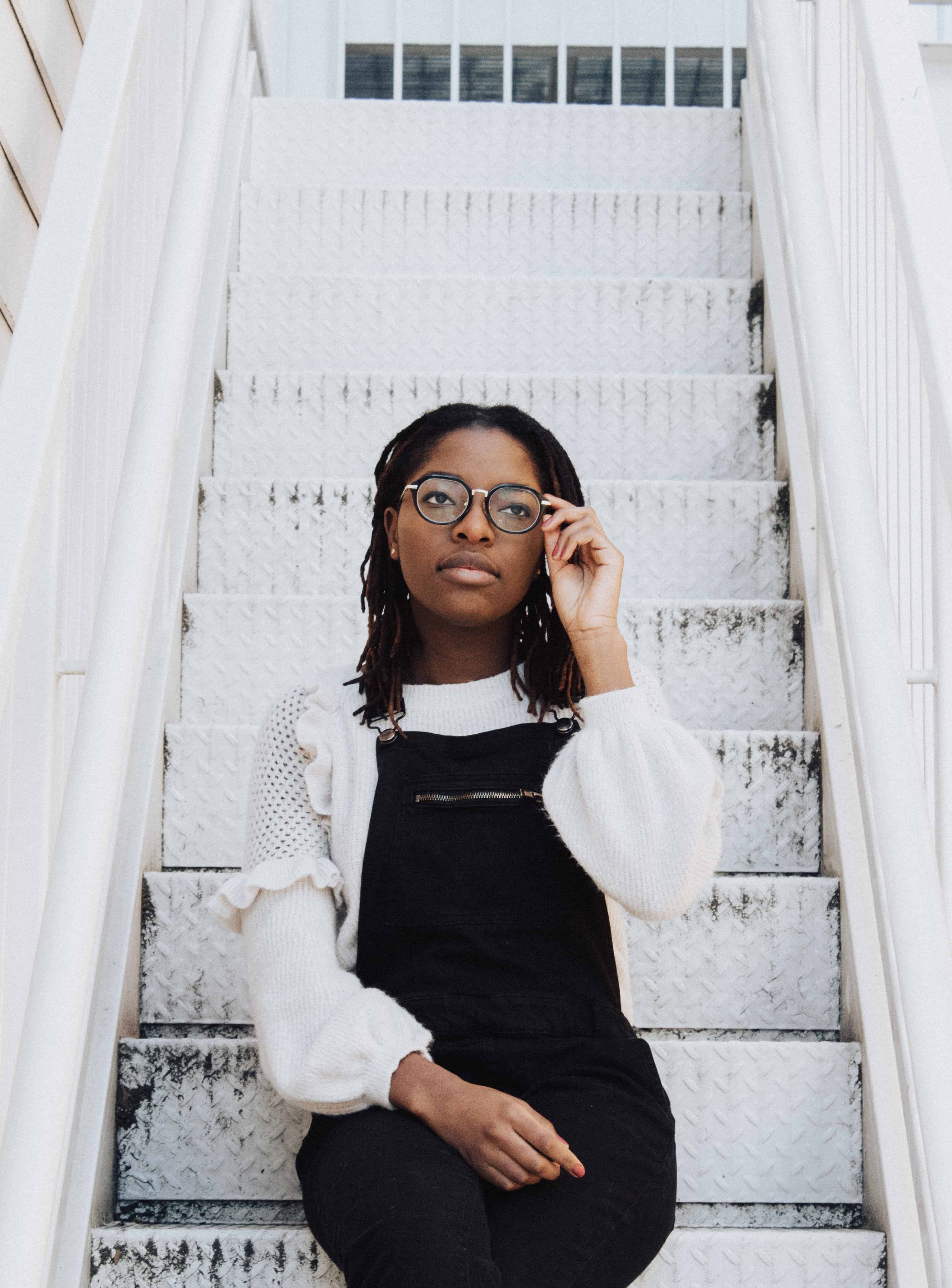 young black woman in glasses